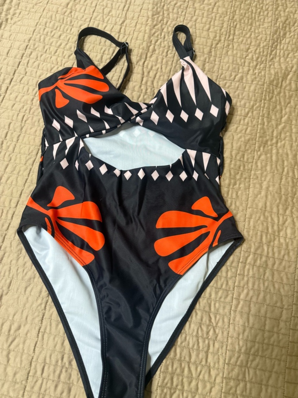 Black One-Piece Swimsuit with Bold Orange Floral Print